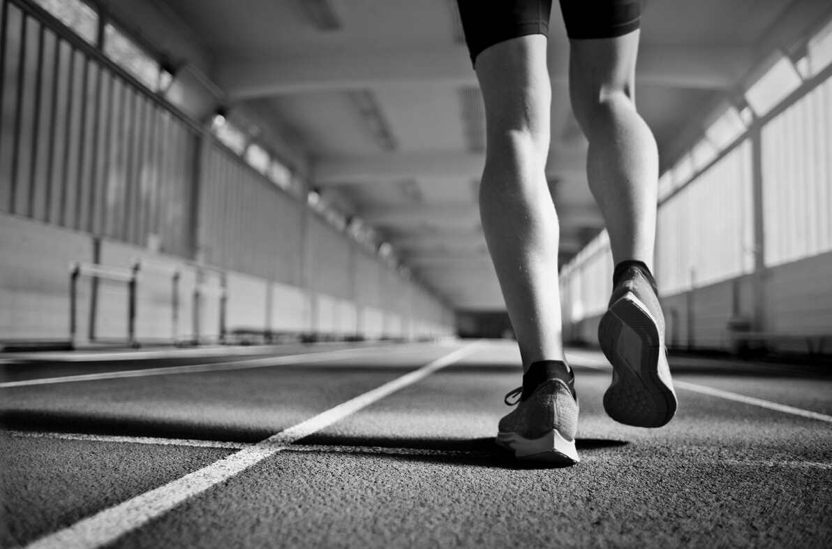 Fit athlete during training on running track